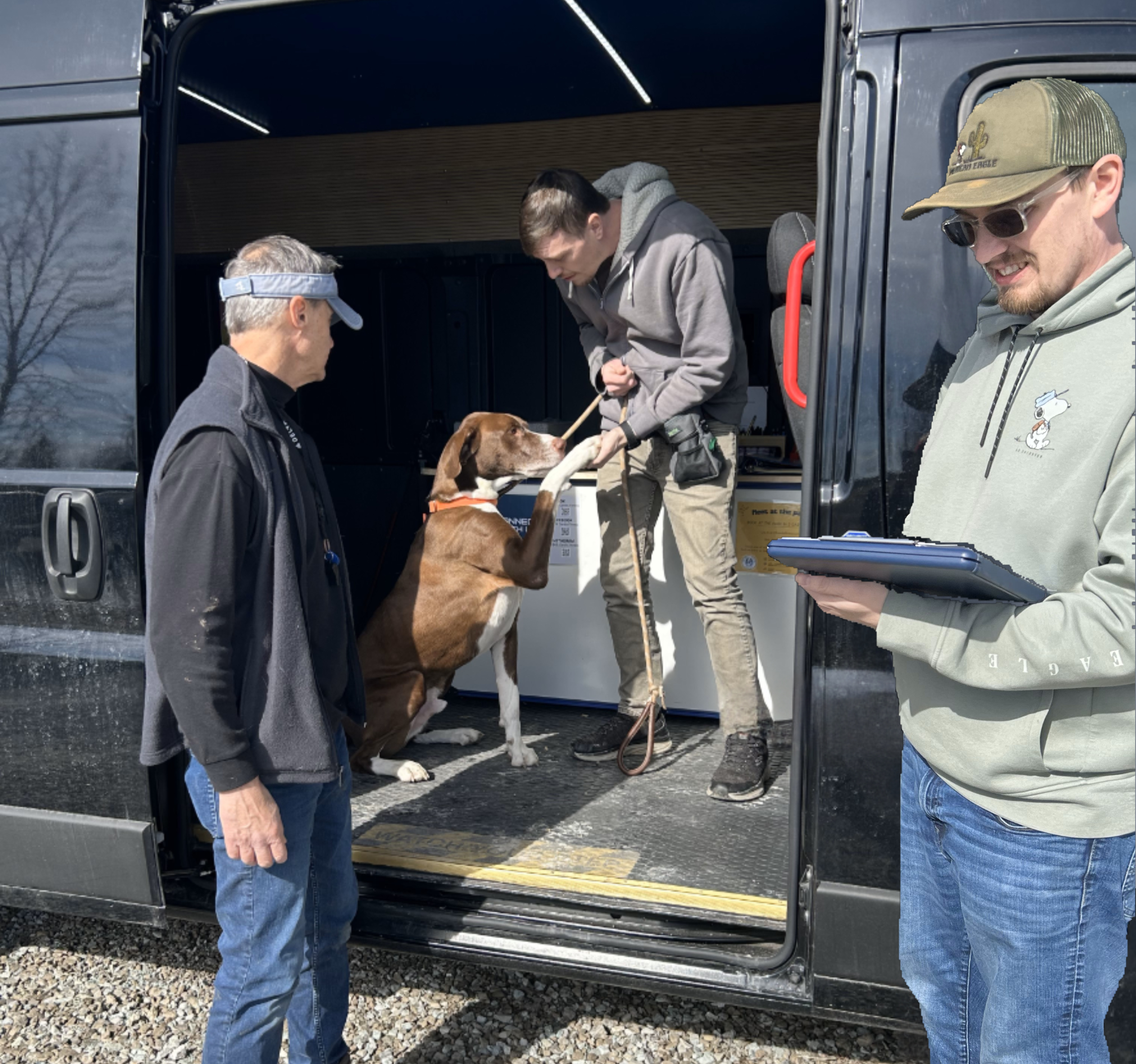 A dog meeting the K9 Cardio Fitness team at the mobile gym